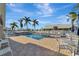 Community pool with ample seating and a relaxing atmosphere at 805 Harrington Lake N Dr # 76, Venice, FL 34293