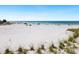 Wide sandy beach with gentle waves, perfect for relaxation and recreation at 1035 Seaside Dr # 305, Sarasota, FL 34242