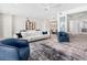 Bright and airy living room features a large white couch and open layout perfect for entertaining at 1035 Seaside Dr # 305, Sarasota, FL 34242