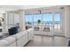 Stylish living room featuring floor-to-ceiling windows with views of the beach at 1035 Seaside Dr # 305, Sarasota, FL 34242