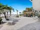 Stylish patio space with comfortable seating, beach views and a pergola at 1035 Seaside Dr # 305, Sarasota, FL 34242