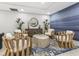 Elegant sitting area with comfortable chairs, a unique coffee table, and stylish decor at 1035 Seaside Dr # 305, Sarasota, FL 34242