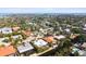 Aerial view of neighborhood near the coast, showing various houses and waterways at 322 Avenida De Paradisio, Sarasota, FL 34242