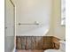 Unfinished bathroom with new insulation and flooring at 322 Avenida De Paradisio, Sarasota, FL 34242