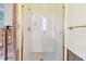 Renovated shower with glass enclosure and gold fixtures at 322 Avenida De Paradisio, Sarasota, FL 34242
