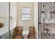 Small bathroom with toilet and window; renovation in progress at 322 Avenida De Paradisio, Sarasota, FL 34242