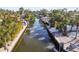Aerial of canal, showing waterfront homes, lush landscaping, and boats at 322 Avenida De Paradisio, Sarasota, FL 34242