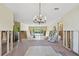 Renovation in progress, dining room features chandelier and brick fireplace at 322 Avenida De Paradisio, Sarasota, FL 34242
