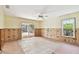 Dining room under renovation with new flooring and pool view at 322 Avenida De Paradisio, Sarasota, FL 34242