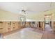 Renovation in progress: Living room with new flooring and ceiling fan at 322 Avenida De Paradisio, Sarasota, FL 34242