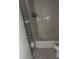 Clean bathroom with a bathtub, toilet and tiled walls at 406 Laurel E Rd, Nokomis, FL 34275