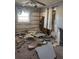 Bedroom under renovation, showing exposed walls and debris at 406 Laurel E Rd, Nokomis, FL 34275