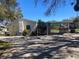 Single-story home with carport and fenced backyard at 406 Laurel E Rd, Nokomis, FL 34275