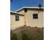 Side view of the house showing a portion of the exterior wall at 406 Laurel E Rd, Nokomis, FL 34275