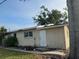 Rear view of the house showcasing a simple design at 406 Laurel E Rd, Nokomis, FL 34275
