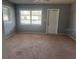 Bright living room with neutral walls and carpeted floors at 406 Laurel E Rd, Nokomis, FL 34275