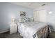 Guest bedroom with a queen-size bed and double closets at 4854 Sabal Lake Cir, Sarasota, FL 34238