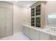 Elegant bathroom with double vanity, large mirror, and upgraded cabinetry at 616 Mangrove Point Rd, Siesta Key, FL 34242