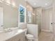 Bathroom with walk-in shower, toilet and single vanity at 616 Mangrove Point Rd, Siesta Key, FL 34242