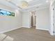 Spacious bedroom with access to bathroom and walk-in closet at 616 Mangrove Point Rd, Siesta Key, FL 34242