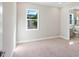 Spacious bedroom with plush carpeting and a view at 616 Mangrove Point Rd, Siesta Key, FL 34242