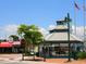 Town square with gazebo, shops, and a red striped restaurant at 616 Mangrove Point Rd, Siesta Key, FL 34242