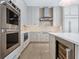 Modern kitchen with stainless steel appliances and wine cooler at 616 Mangrove Point Rd, Siesta Key, FL 34242
