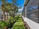 Landscaped yard with lush tropical plants at 616 Mangrove Point Rd, Siesta Key, FL 34242