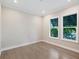 Bright office space with wood flooring and large windows at 616 Mangrove Point Rd, Siesta Key, FL 34242
