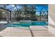 Inviting pool and spa with screened enclosure at 616 Mangrove Point Rd, Siesta Key, FL 34242