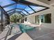 Relaxing pool and spa area with screened enclosure at 616 Mangrove Point Rd, Siesta Key, FL 34242