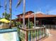 Vibrant restaurant with colorful wooden fence and patio seating at 616 Mangrove Point Rd, Siesta Key, FL 34242