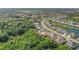 Aerial view of a neighborhood with houses near a lake at 7168 Ryedale Ct, Sarasota, FL 34241