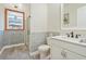 Clean bathroom with white cabinets, subway tile, and marble countertop at 7168 Ryedale Ct, Sarasota, FL 34241