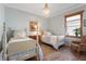 Charming bedroom with two twin beds and hardwood floors at 7168 Ryedale Ct, Sarasota, FL 34241