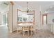 Bright dining area features a round table and white chairs, with a mirrored view at 7168 Ryedale Ct, Sarasota, FL 34241