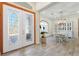 Bright and airy entryway with wood floors and double doors at 7168 Ryedale Ct, Sarasota, FL 34241