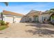 House with a three-car garage and a large driveway at 7168 Ryedale Ct, Sarasota, FL 34241
