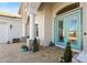 Elegant teal front door with beveled glass and sidelights at 7168 Ryedale Ct, Sarasota, FL 34241