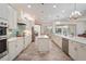 Open kitchen boasting a large island, stainless steel appliances, and white cabinets at 7168 Ryedale Ct, Sarasota, FL 34241