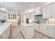 Spacious kitchen with island, stainless steel appliances, and white cabinets at 7168 Ryedale Ct, Sarasota, FL 34241