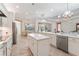 Bright kitchen featuring a large island, stainless steel appliances, and white cabinets at 7168 Ryedale Ct, Sarasota, FL 34241