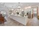 Bright kitchen with large island, stainless steel appliances, and white cabinets at 7168 Ryedale Ct, Sarasota, FL 34241
