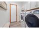 Convenient laundry room with washer, dryer, and additional storage at 7168 Ryedale Ct, Sarasota, FL 34241