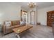 Relaxing living room with a comfortable couch and wooden coffee table at 7168 Ryedale Ct, Sarasota, FL 34241