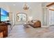 Bright living room with comfortable seating and large windows at 7168 Ryedale Ct, Sarasota, FL 34241