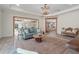 Open living room with a view into the kitchen and backyard at 7168 Ryedale Ct, Sarasota, FL 34241