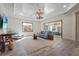 Bright living area with comfortable seating and a view of the pool at 7168 Ryedale Ct, Sarasota, FL 34241