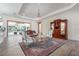 Elegant living room features a sitting area with antique furniture and a view of the pool at 7168 Ryedale Ct, Sarasota, FL 34241
