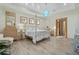 Spacious main bedroom with a canopy bed and plenty of natural light at 7168 Ryedale Ct, Sarasota, FL 34241
